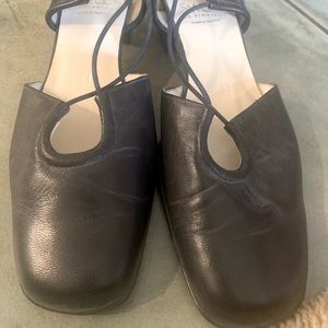 Black leather heels labeled size 41